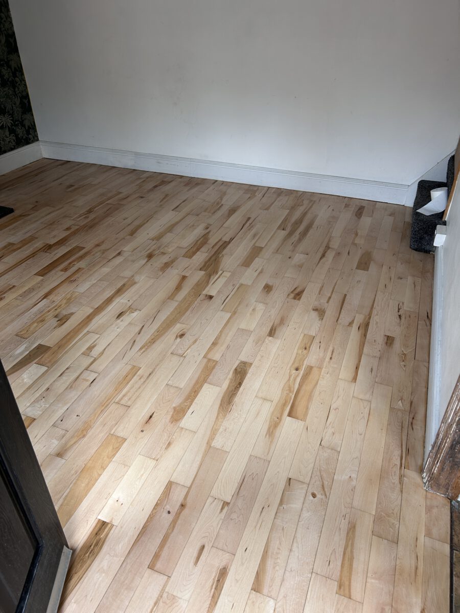 Finished maple wood floor restored by Evo Wood Flooring with a smooth, durable finish and enhanced natural character